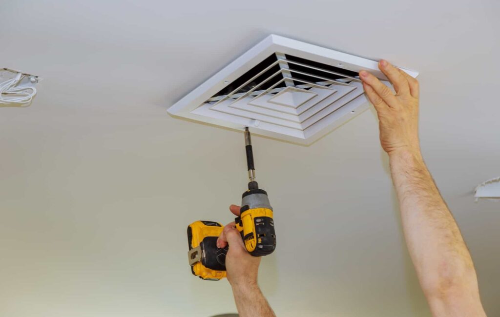 Air Conditioner being maintained 